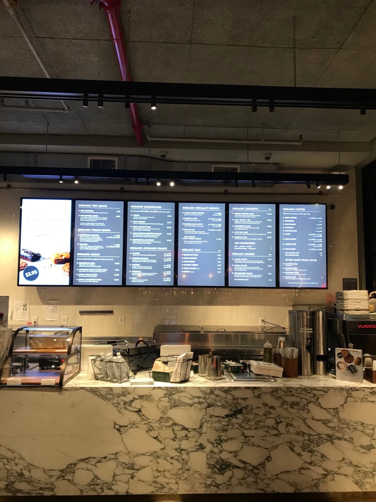 Digital menu boards in a cafe service area