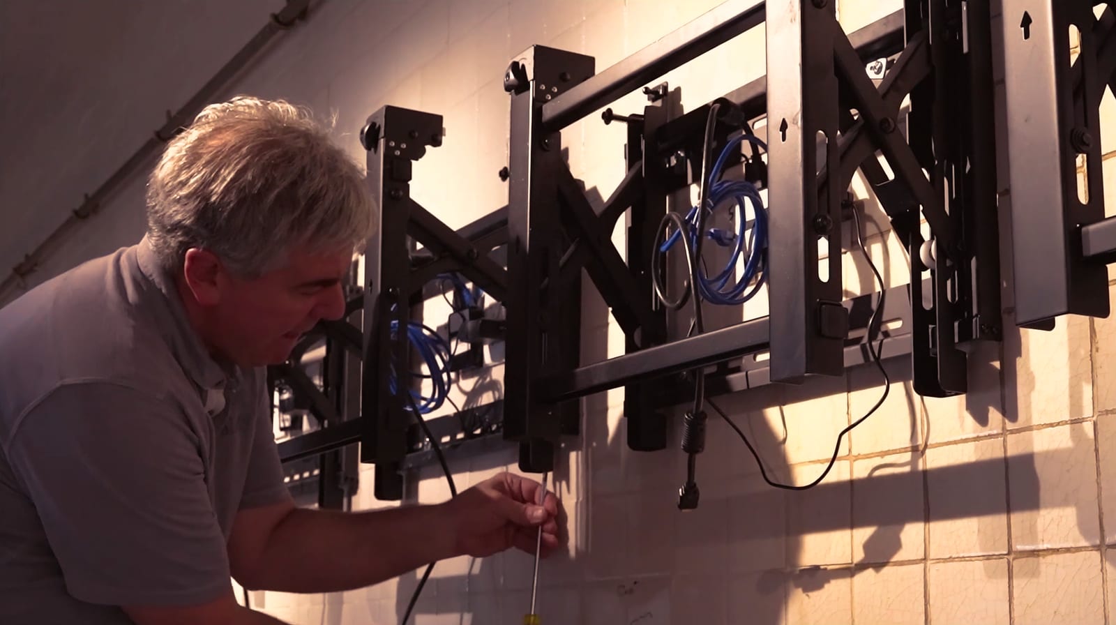 Reality Operative installing commercial display hardware